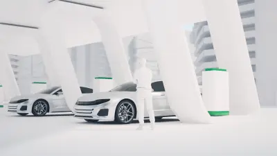 A man and two electric cars at a hydrogen filling station