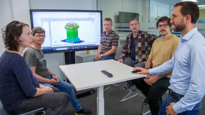 Bosch Linz design and simulation team in meeting before electrolysis stack model